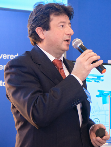 Conference speaker presenting at a conference session 