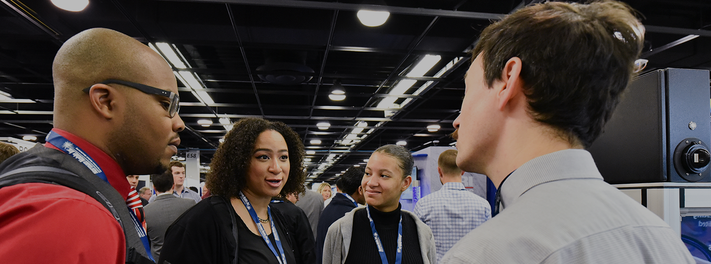 Attendees talking at tradeshow